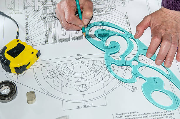 istock engineering drawings with hands drawing  project by pencil on paper 473118386
