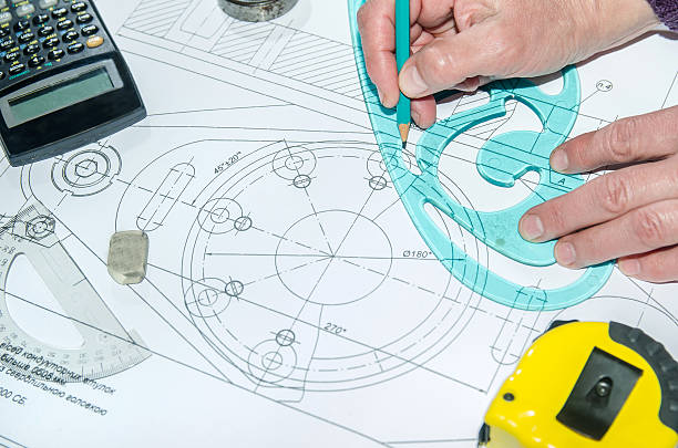 istock engineering drawings with hands drawing  project by pencil on paper 473118394