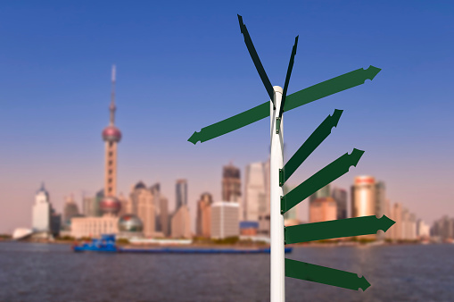 Blank road signs, Shanghai skyline in the background