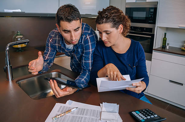 istock Couple reviewing their accounts with a digital tablet 473126730