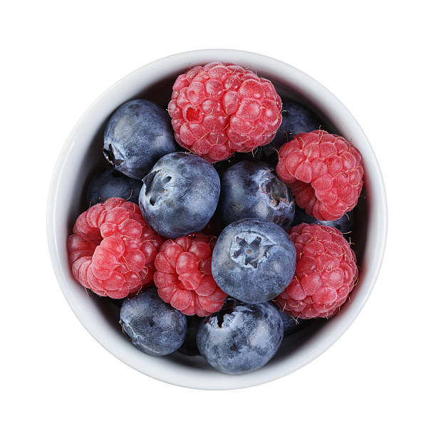 istock fresh raspberry and blueberry in bowl directly above 473130380