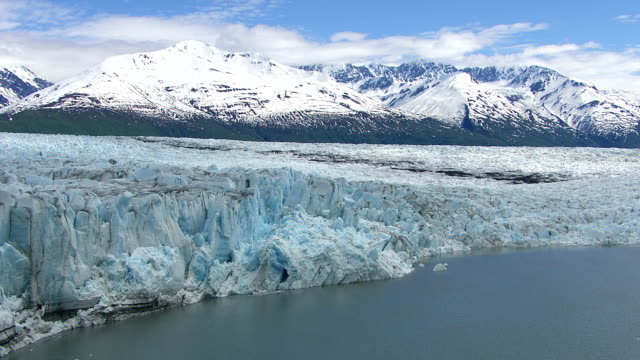 Flying over lake and glacier, Alaska