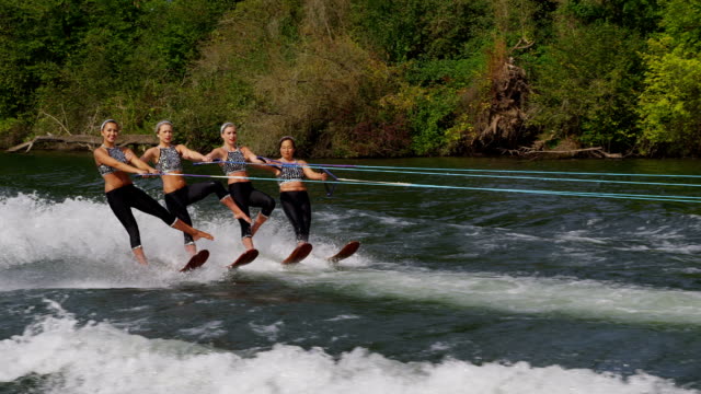 Water ski team performers, slow motion
