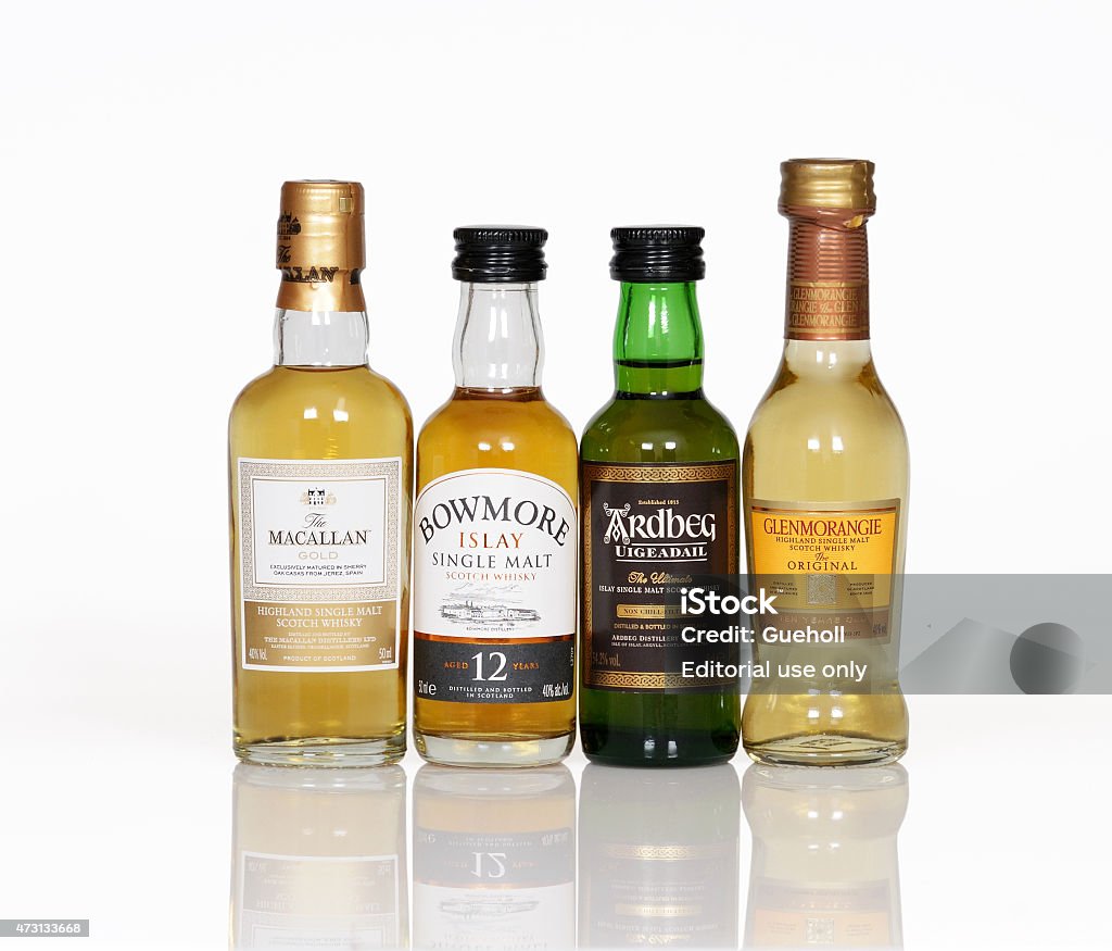 Whisky miniature bottle Bayreuth, Germany – May 01, 2015: miniatures of Scottish single malt whiskies from the distilleries Macallan, Bowmore, Ardbeg, Genmorangie  2015 Stock Photo