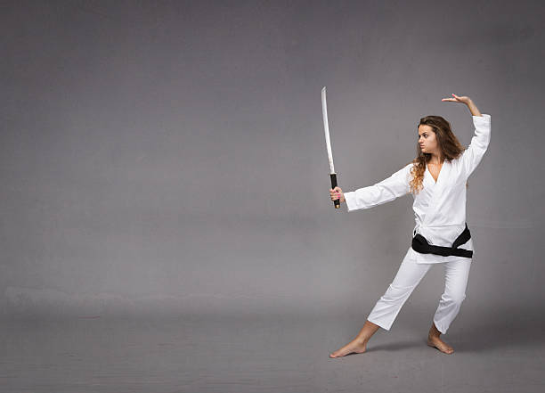 istock kung fu with katana on hand 473136942