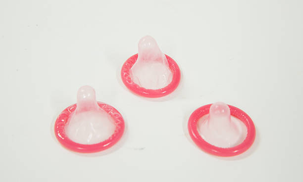 istock Stop HIV,pink condoms. 473138516