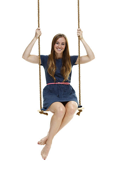 istock Smiling woman swinging 473138578