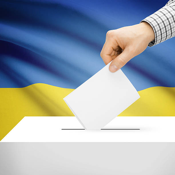 istock Ballot box with national flag on background - Ukraine 473139314