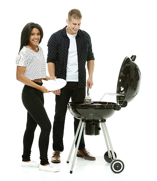 istock Couple together by the barbecue grill 473142544