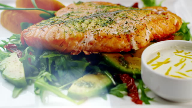 Baked salmon on a plate.