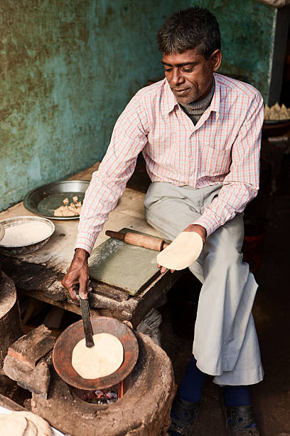 istock Indian street vendor preparing food - chapatti, flat bread 473145824