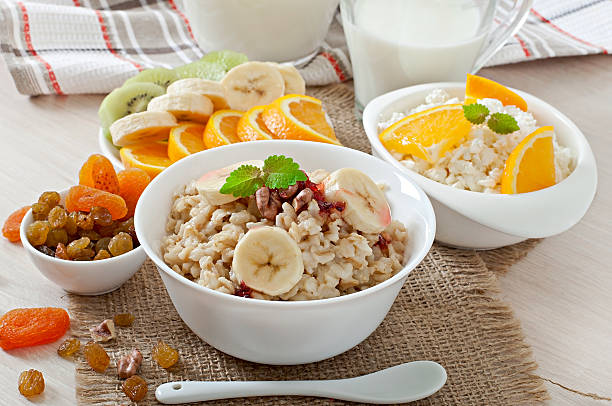 istock Healthy breakfast - oatmeal, cottage cheese, milk and fruit 473149556