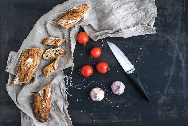 French baguette cut into pieces, cherry-tomatoes and garlic