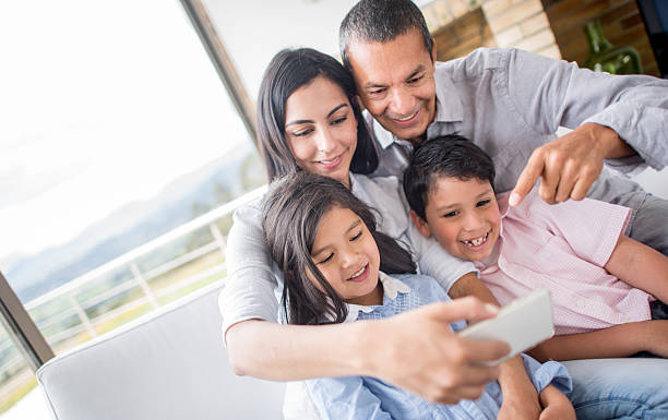istock Latin family taking a selfie 473153204
