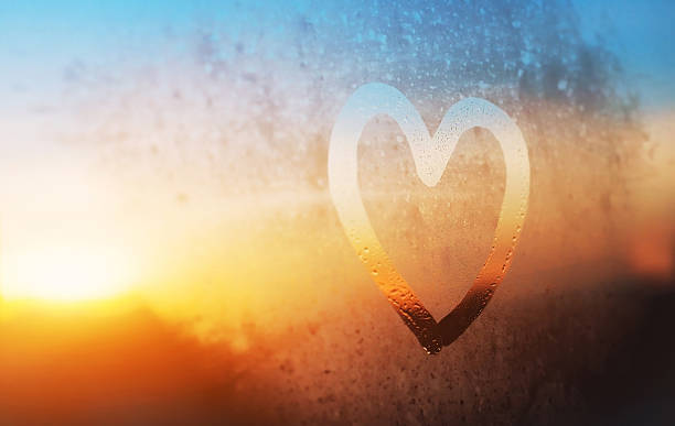 heart on misted window heart painted on frozen glass hope concept stock pictures, royalty-free photos & images
