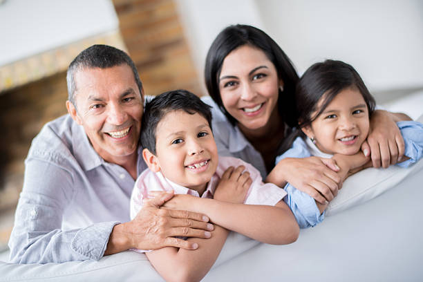istock Beautiful Latin family at home 473157018
