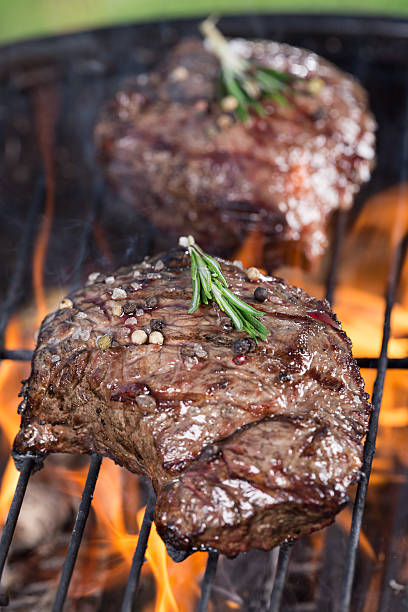 istock Beef steak on garden grill 473157110
