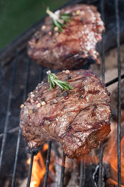 istock Beef steak on garden grill 473157112