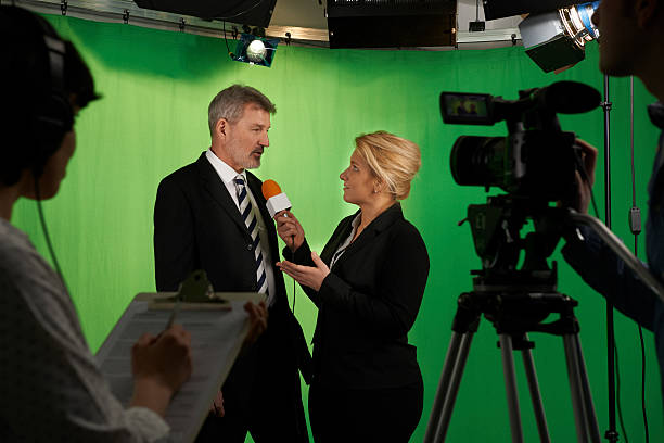 istock Female Presenter Interviewing  In Television Studio With Crew In 473158812