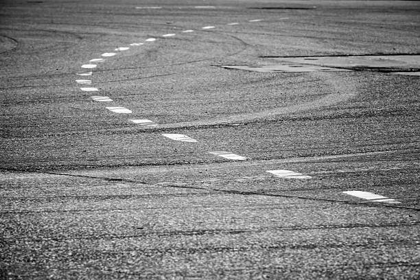 istock White lines over asphalt, road marking 473159100