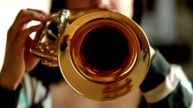 front-view of woman playing Flugelhorn / Trumpet