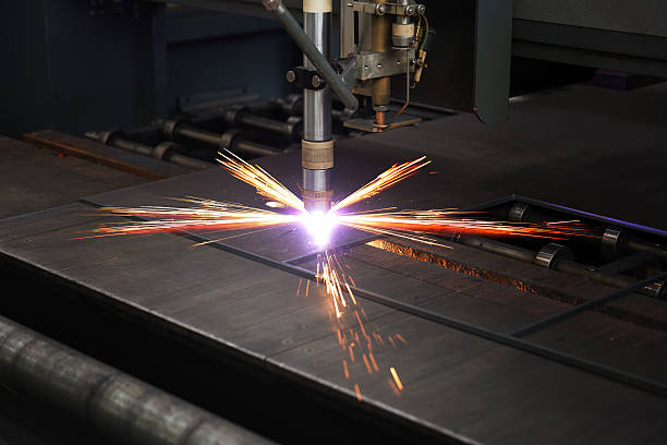 Industrial cnc plasma machine cutting of metal plate stock photo