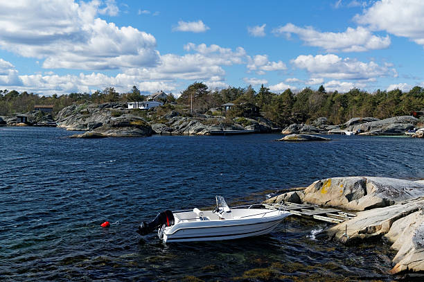 istock Small motor boats on the coast in Norway 473162966