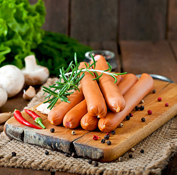 istock Sausage on a wooden background 473167538