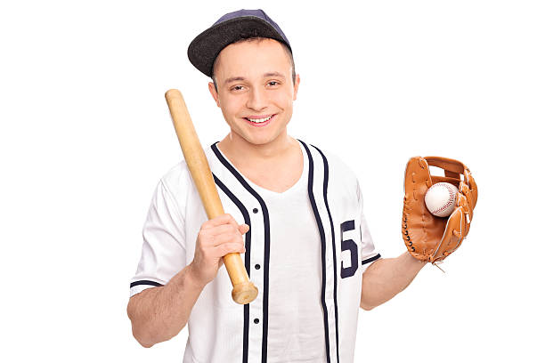 young man holding bate de béisbol y una bola - men baseball baseball cap baseball bat fotografías e imágenes de stock