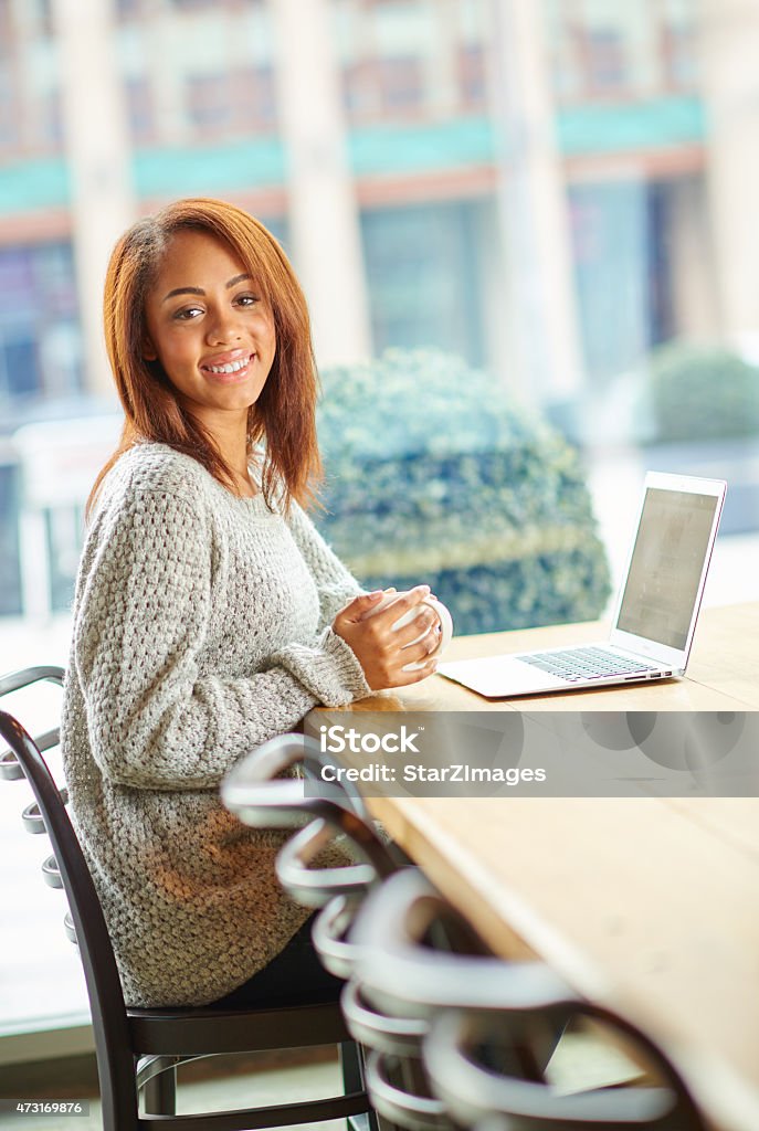 Freelancing in coffee shop Young authentic woman working in coffee shop 20-24 Years Stock Photo