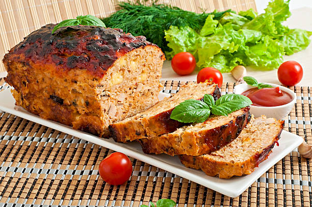 istock Homemade ground meatloaf with ketchup and basil 473174314