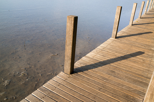 Wooden bridge on the seashore.