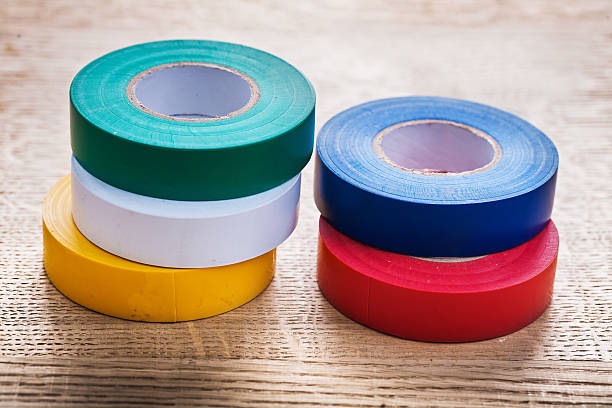 istock five colored rolls of insulating tape on wooden board constructi 473175274