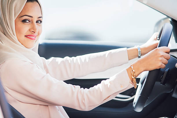 istock Middle easter woman driving a luxury car in Dubai 473175426