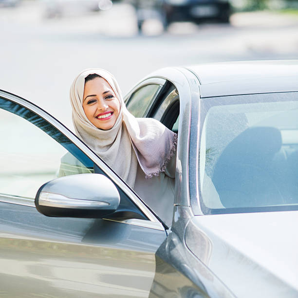 istock Middle easter woman entering a luxury car in Dubai 473175434