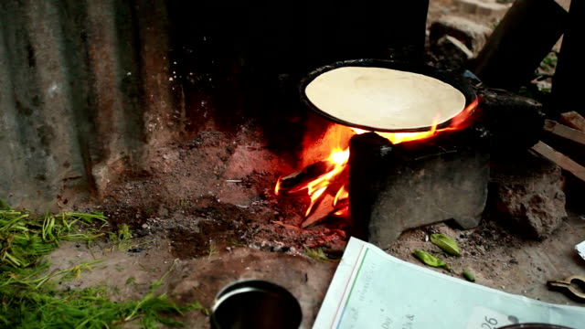 Rural traditional Indian women preparing food