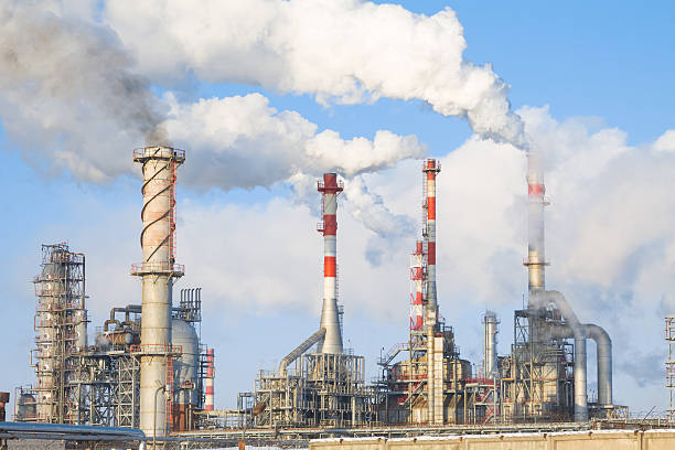 istock factory with chimney striped in winter 473178201
