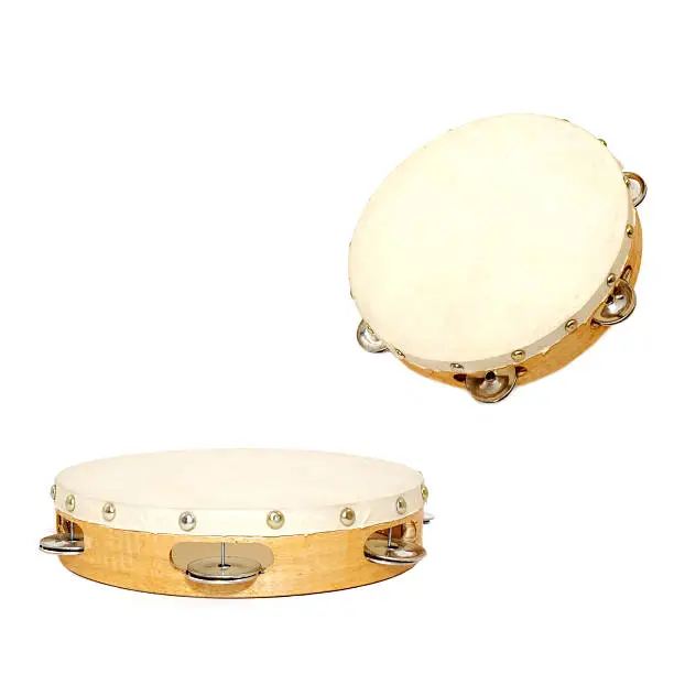 wood and leather tambourine on white background