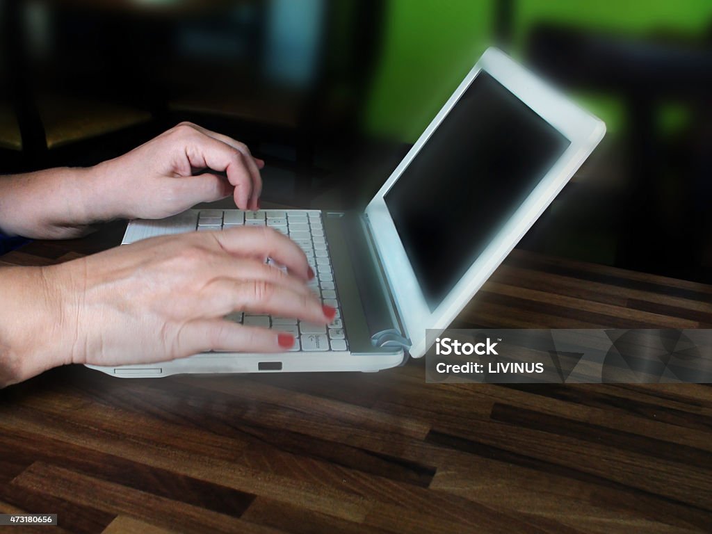 Using Laptop To Search While in A coffee Shop 2015 Stock Photo
