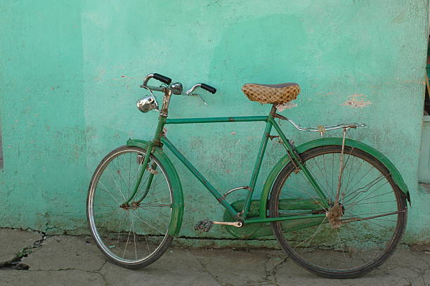Old Bicycle. Green background. Africa.