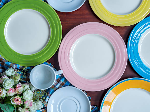 istock Blank plates with checked tablecloth on wooden table background 473184988