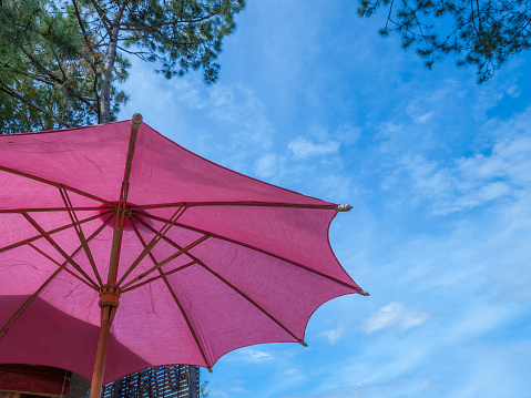 Red umbrella against the blue sky, in Phetchabun, thailand