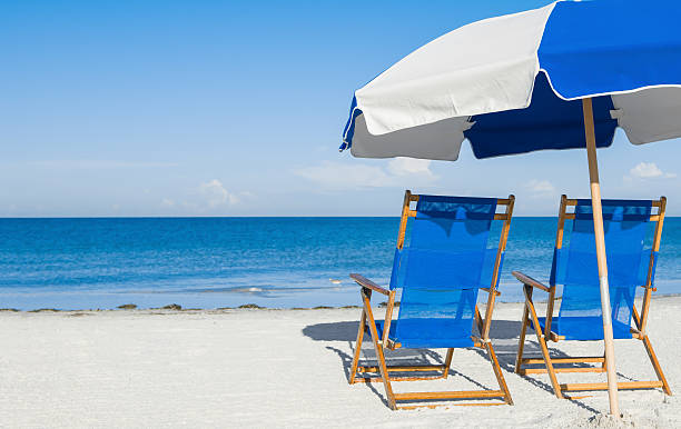 istock sun loungers and a beach umbrella on silver sand 473188926