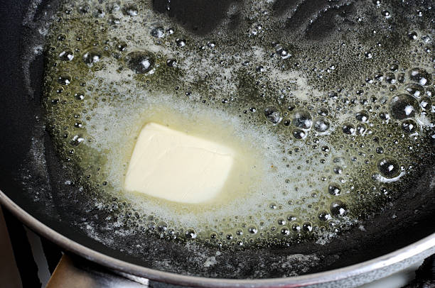 istock Piece of butter melting on non-stick pan 473191344