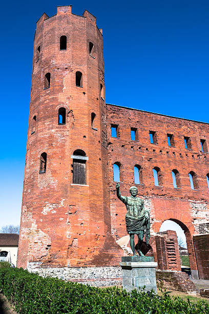 The Statue of Ottaviano Augusto and the Torri Palatine, Turin Turin,Italy,Europe - March 27, 2015 : The Statue of Ottaviano Augusto in front of the Palatine Towers in Turin torri gate stock pictures, royalty-free photos & images