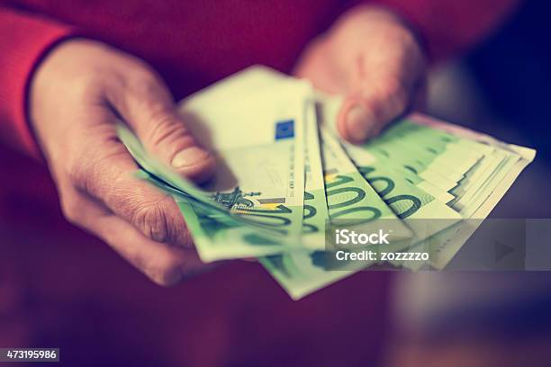 Euros In Hand Stock Photo - Download Image Now - 2015, Activity, Adult