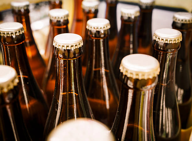 istock Beer Bottle in row Close up 473197548