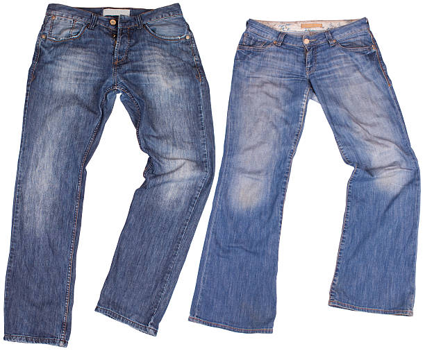 istock Man's and woman's blue jeans isolated on white 473204414
