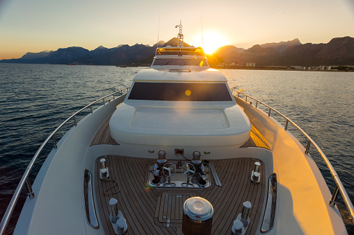 Luxury yacht sailing on the sea during sunset