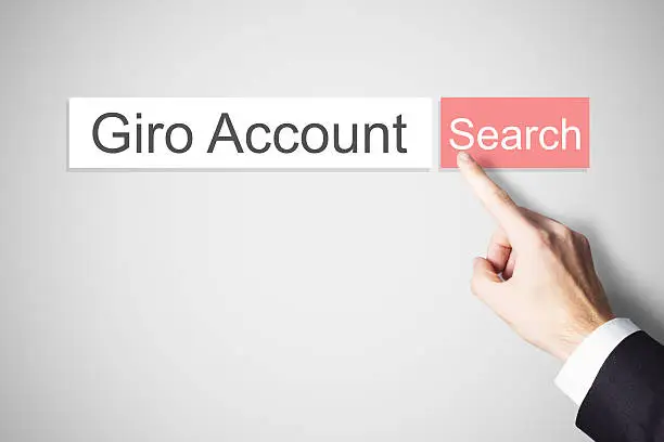 businessmans finger pushing red webbrowser search button giro account